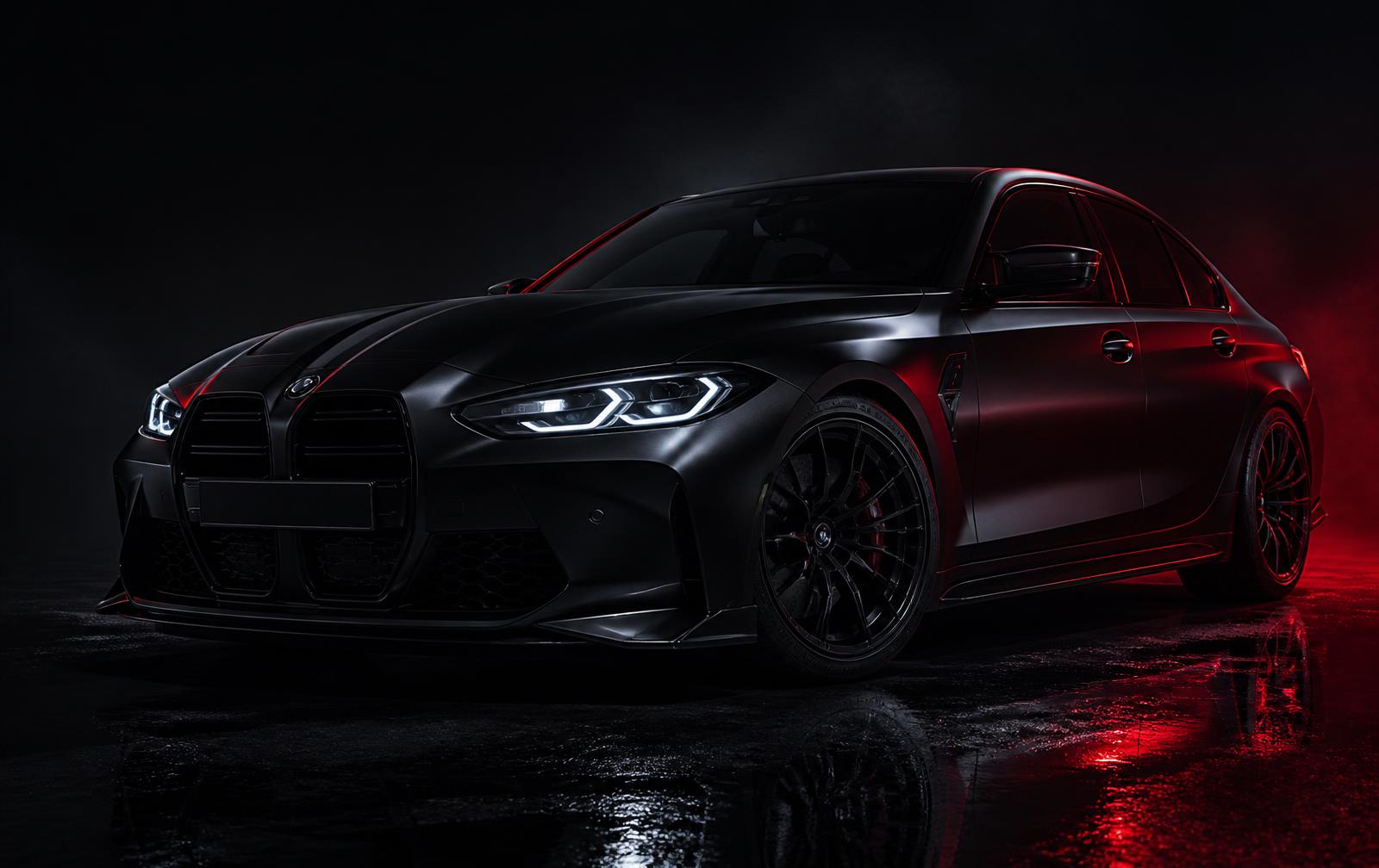 Dark performance sedan lit with red rim light in a studio